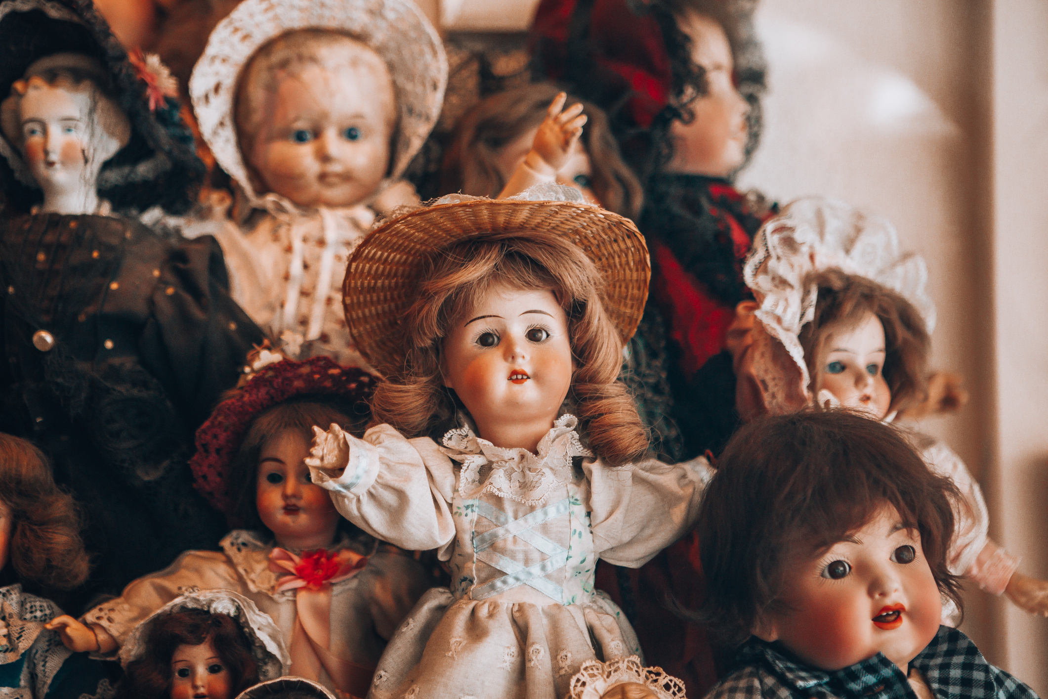 Collection of vintage dolls displayed together