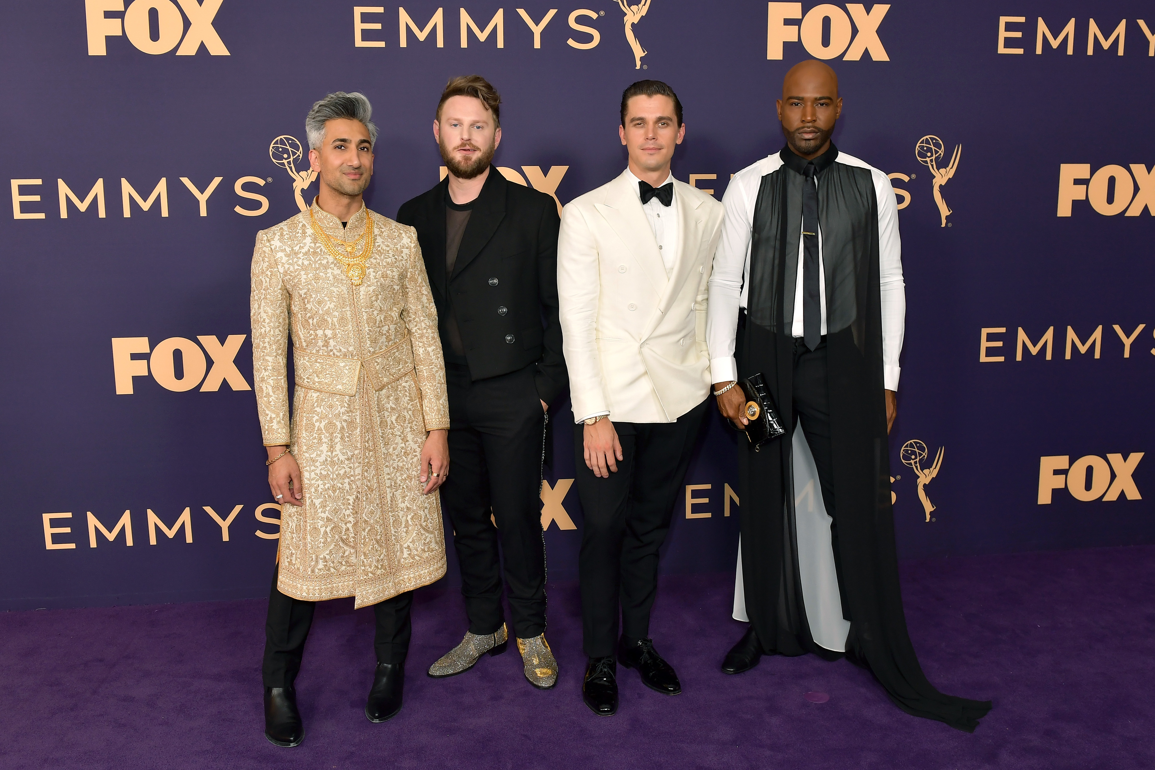 The cast of Queer Eye pose for a group photo on the red carpet