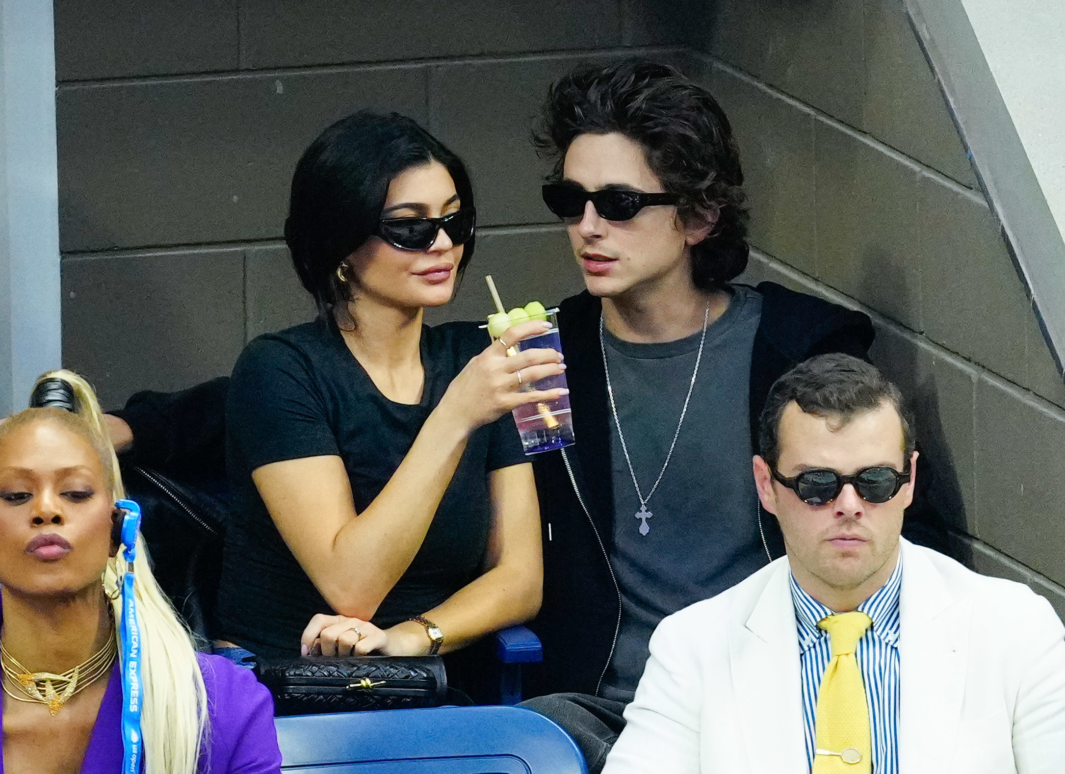 Kylie Jenner and Timothée Chalamet seated side by side at an event