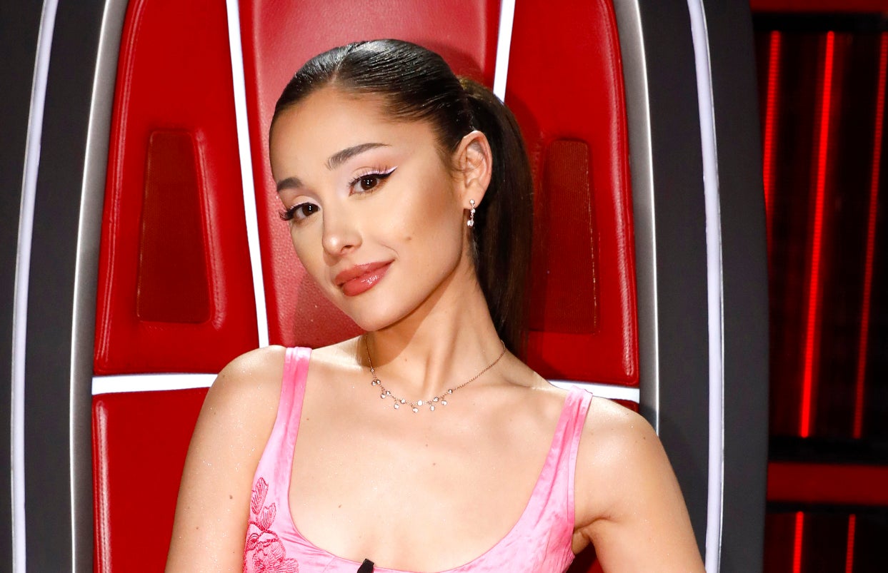 Ariana Grande seated in The Voice&#x27;s red chair