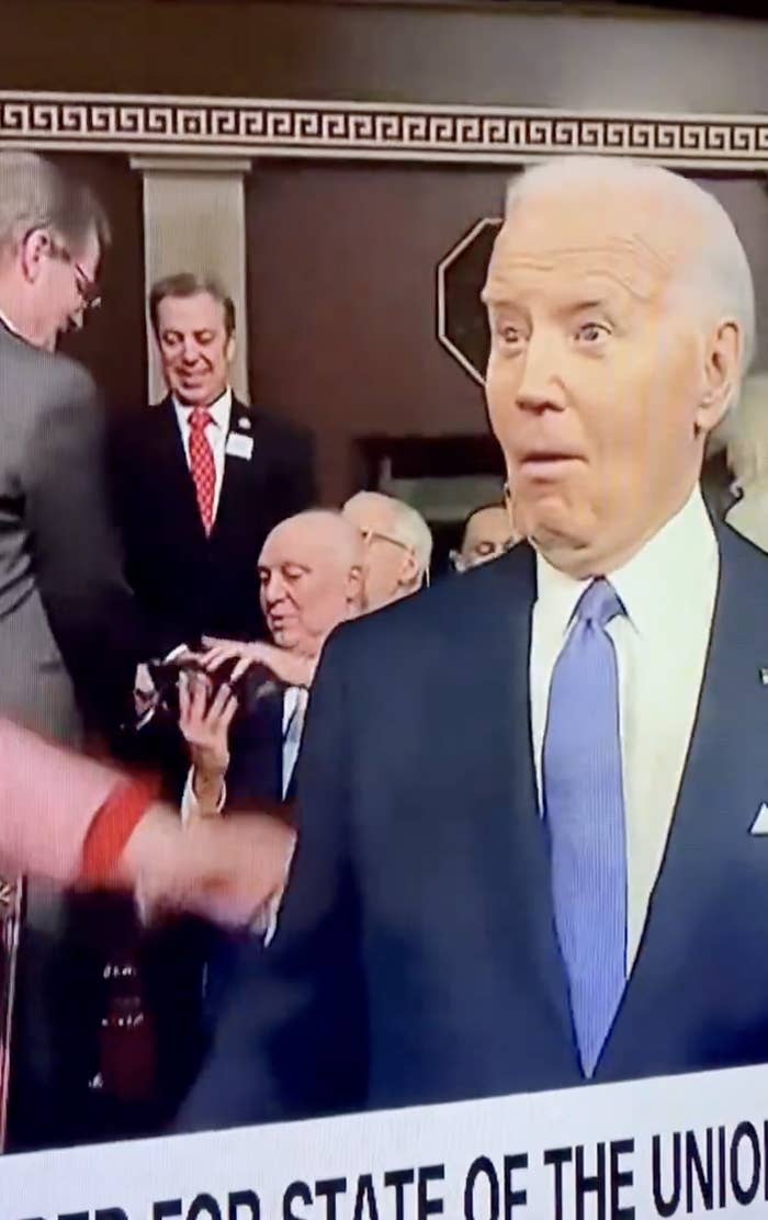 Biden in a blue suit pre–State of the Union address, looking shocked