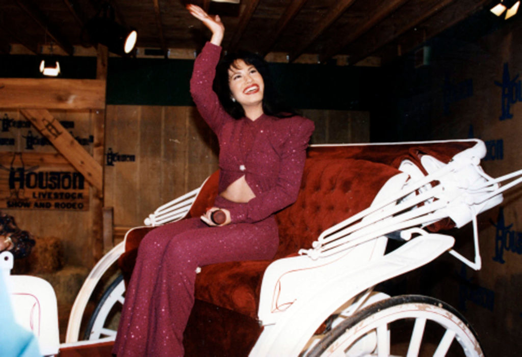 Selena rides in a carriage during a performance at the Houston Livestock Show &amp;amp; Rodeo at the Houston Astrodome