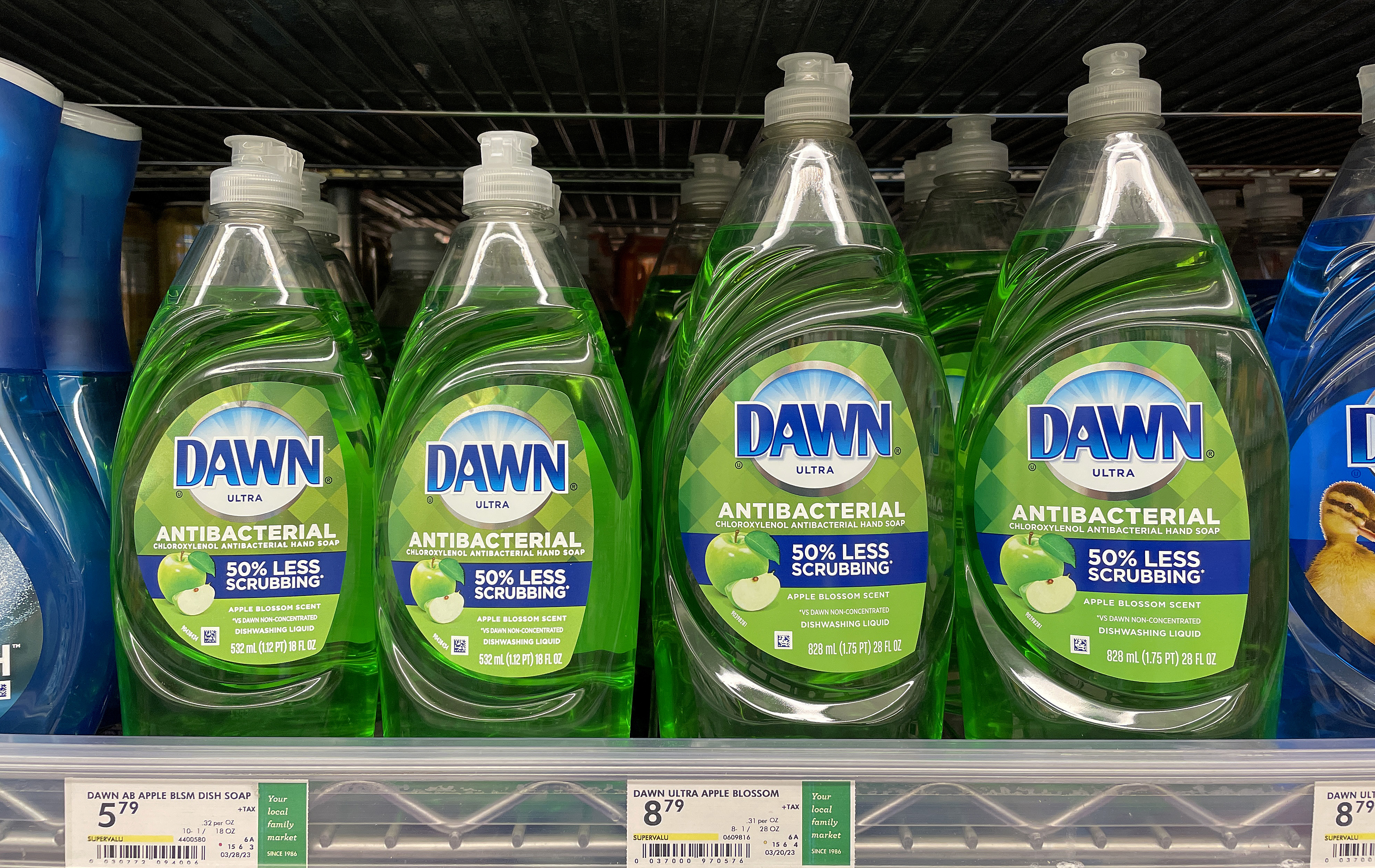 Shelves with bottles of Dawn Ultra Antibacterial dish soap, priced at $5 and $8.79