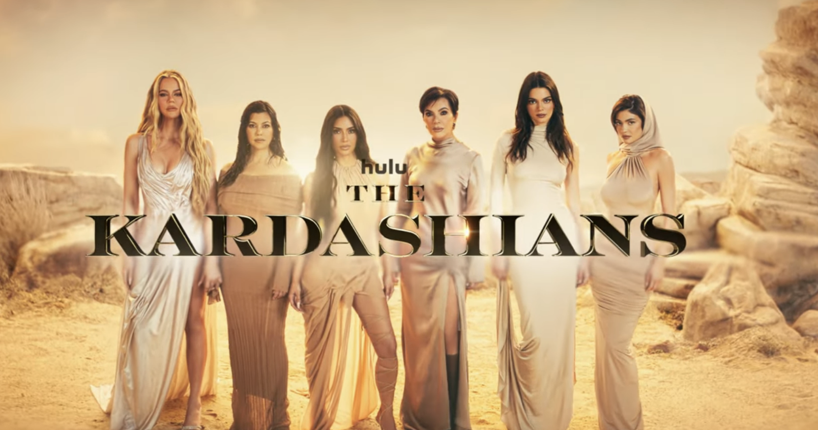 The Kardashian family standing together in a promotional image for their show on Hulu