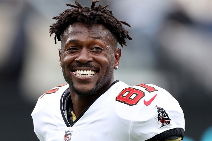 Smiling football player in white Tampa Bay Buccaneers jersey with number 87