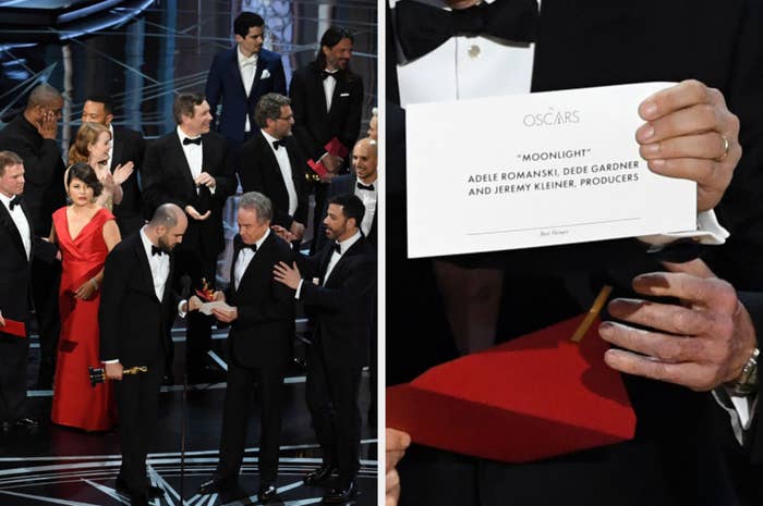 Envelope reading &quot;Moonlight&quot; held onstage with a crowd reacting during an award ceremony