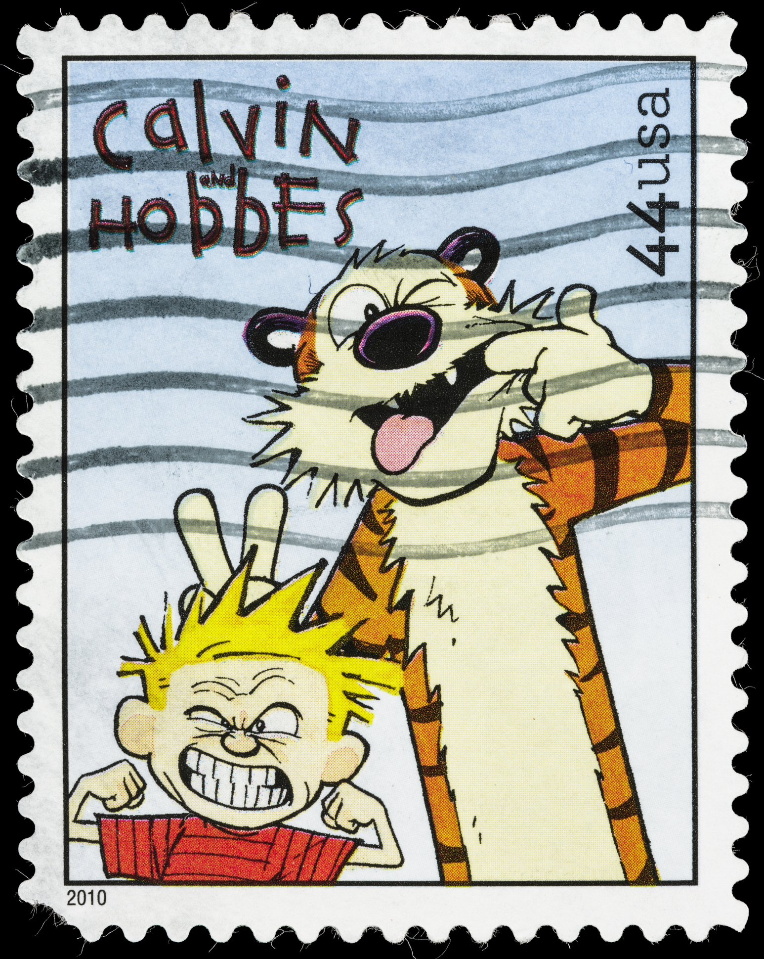 U.S. postage stamp featuring Calvin and Hobbes with Calvin making a face and Hobbes behind him