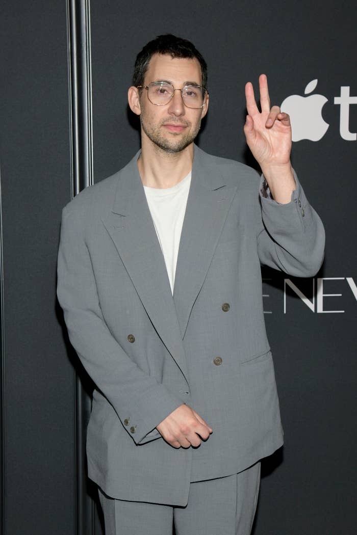 Jack in a suit throwing a peace sign on the red carpet