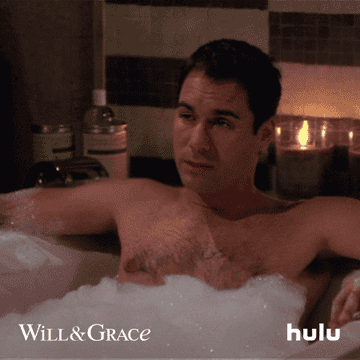 Person in a bubble bath, a scene from TV show Will &amp;amp; Grace