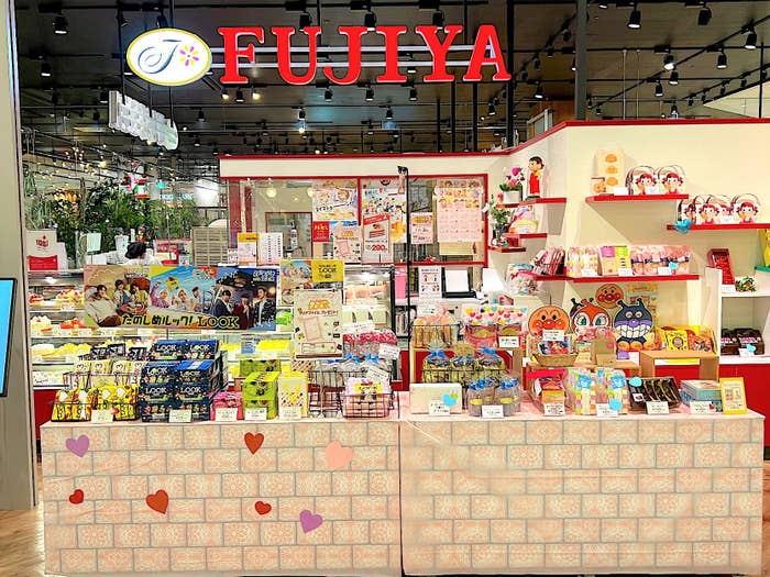 Inside FUJIYA store with an array of snacks and character merchandise on display