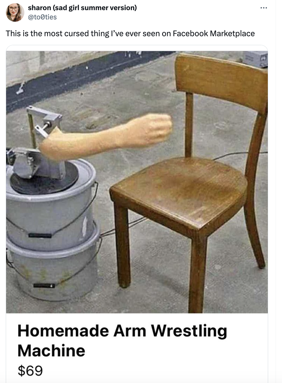 Wooden chair modified with fake human arm for arm wrestling, labeled &quot;Homemade Arm Wrestling Machine, $69&quot;