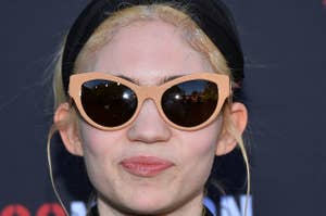 Grimes in jacket and shades