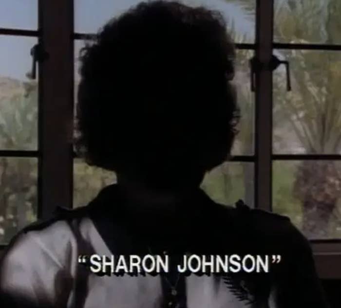 Silhouetted person by a window with the name &quot;Sharon Johnson&quot; onscreen