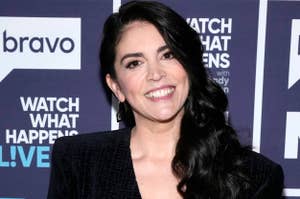 Smiling woman in a black dress at 'Watch What Happens Live' event