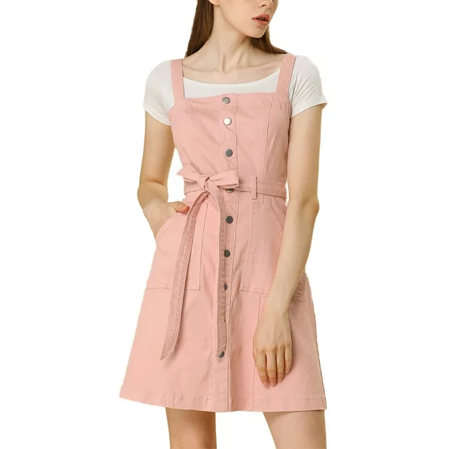 Model in a white t-shirt under a pink buttoned dress with a belt, suitable for a casual shopping style
