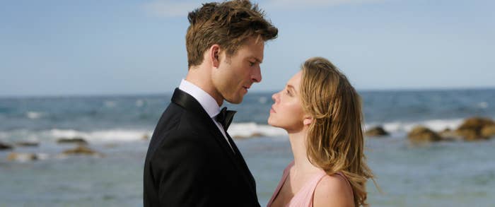 Bea and Ben in formal wear share a close moment on a beach setting