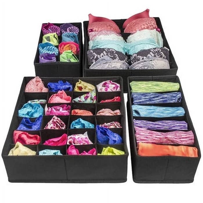 Assorted neatly folded socks and clothing in fabric drawer organizers