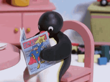 Black cat reading a comic book