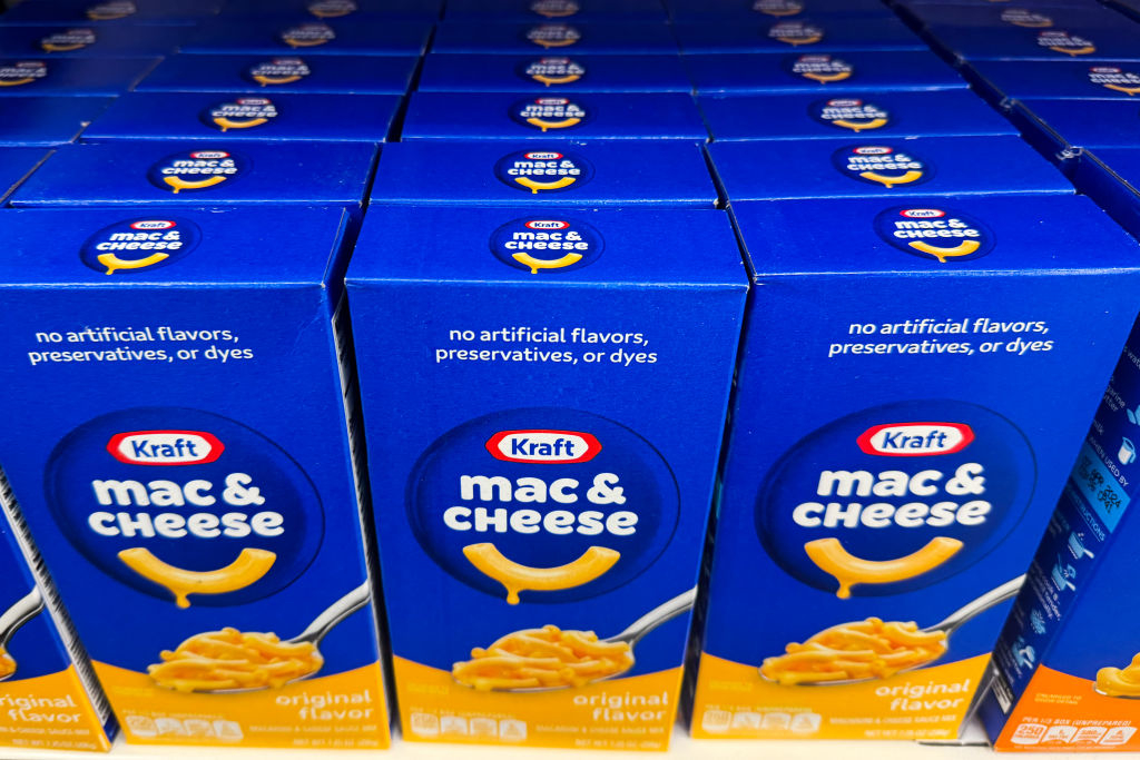 Shelves stocked with boxes of Kraft Mac &amp;amp; Cheese