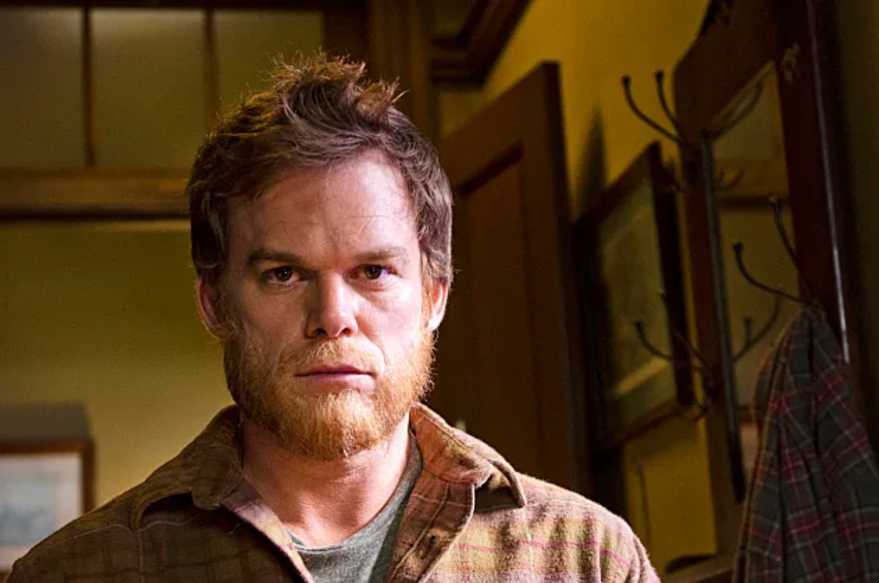 Michael C. Hall in character as Dexter Morgan, looking pensive, in a casual shirt