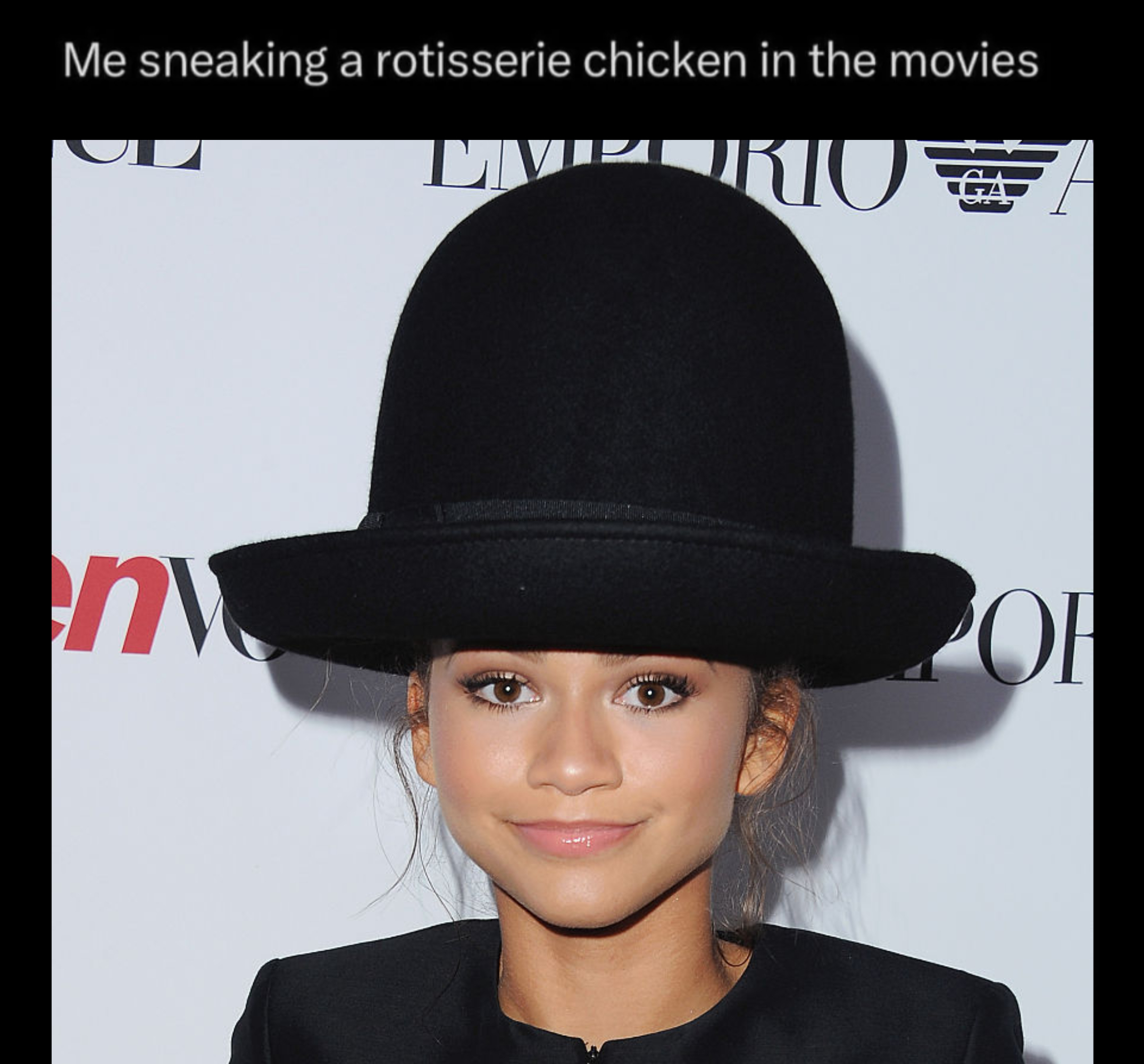 Person wearing an oversized hat with humorous reference to hiding an item under it