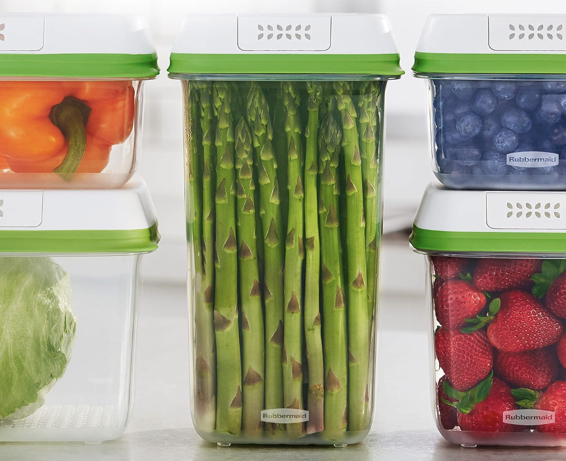 Three Rubbermaid produce containers with assorted vegetables and fruits