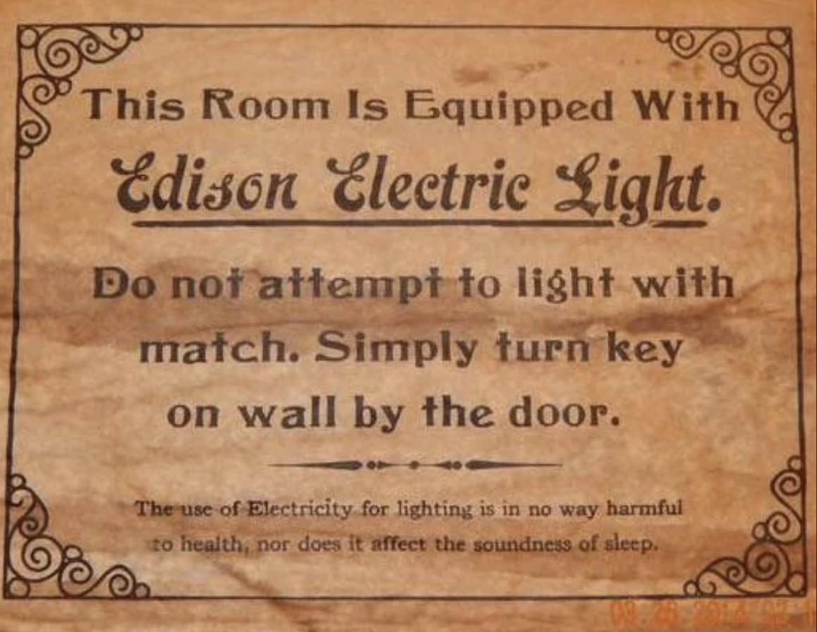 Antique notice stating that the room has Edison Electric Light and instructing not to use matches, just turn the key