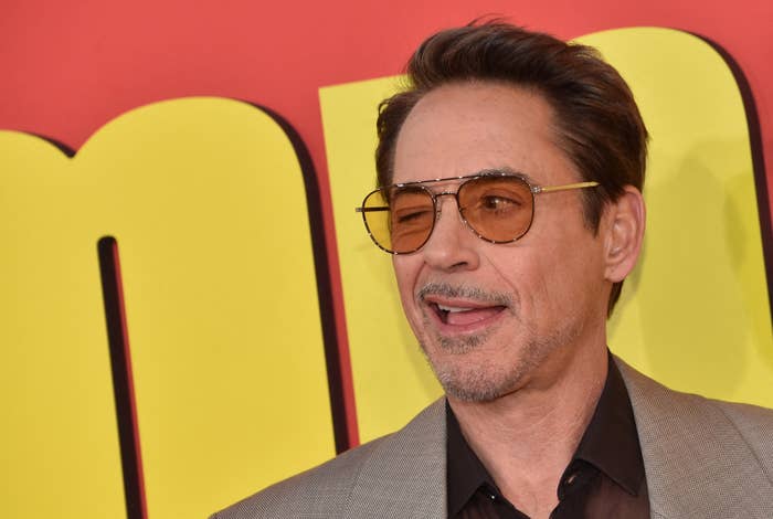 Robert Downey Jr. wearing sunglasses and a suit at an event