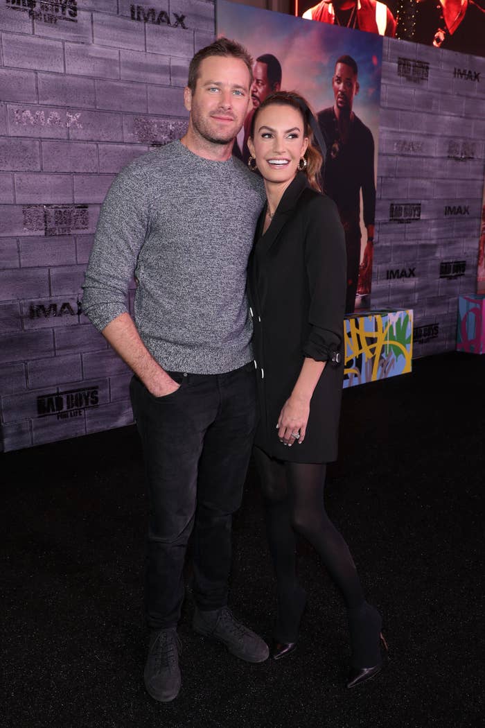 Closeup of Armie Hammer and Elizabeth Chambers on the red carpet