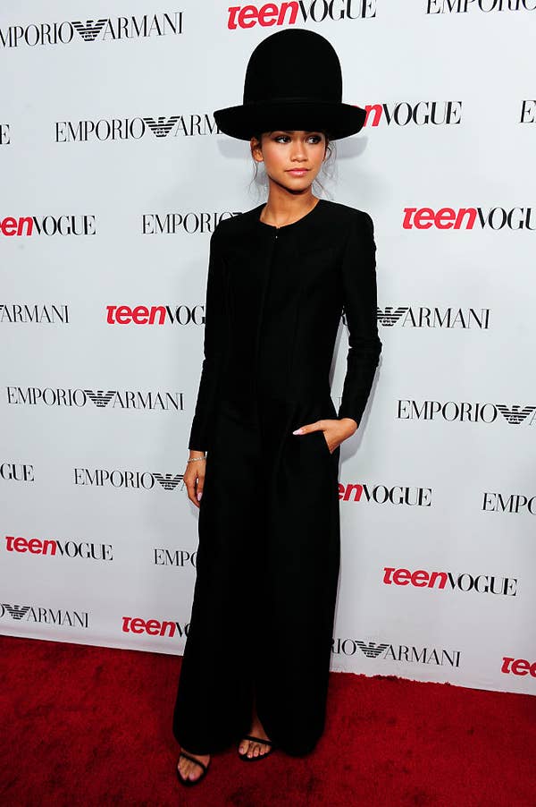 Zendaya in a flowy outfit with a wide-brimmed hat poses at a Teen Vogue event