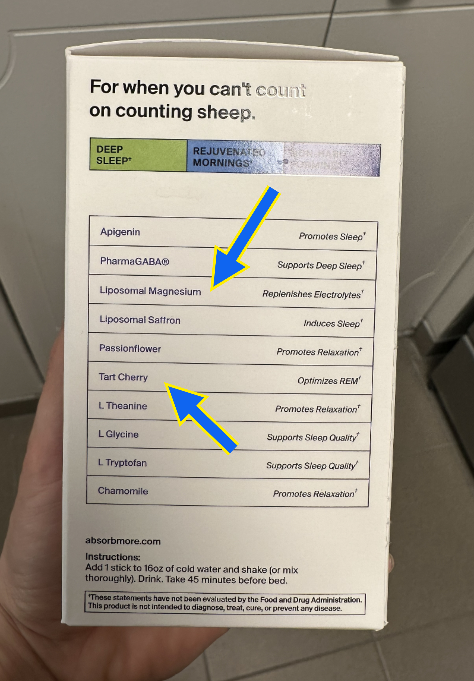 Hand holding a box of &quot;Deep Sleep Assistant&quot; with a list of ingredients and their supposed benefits for improved sleep