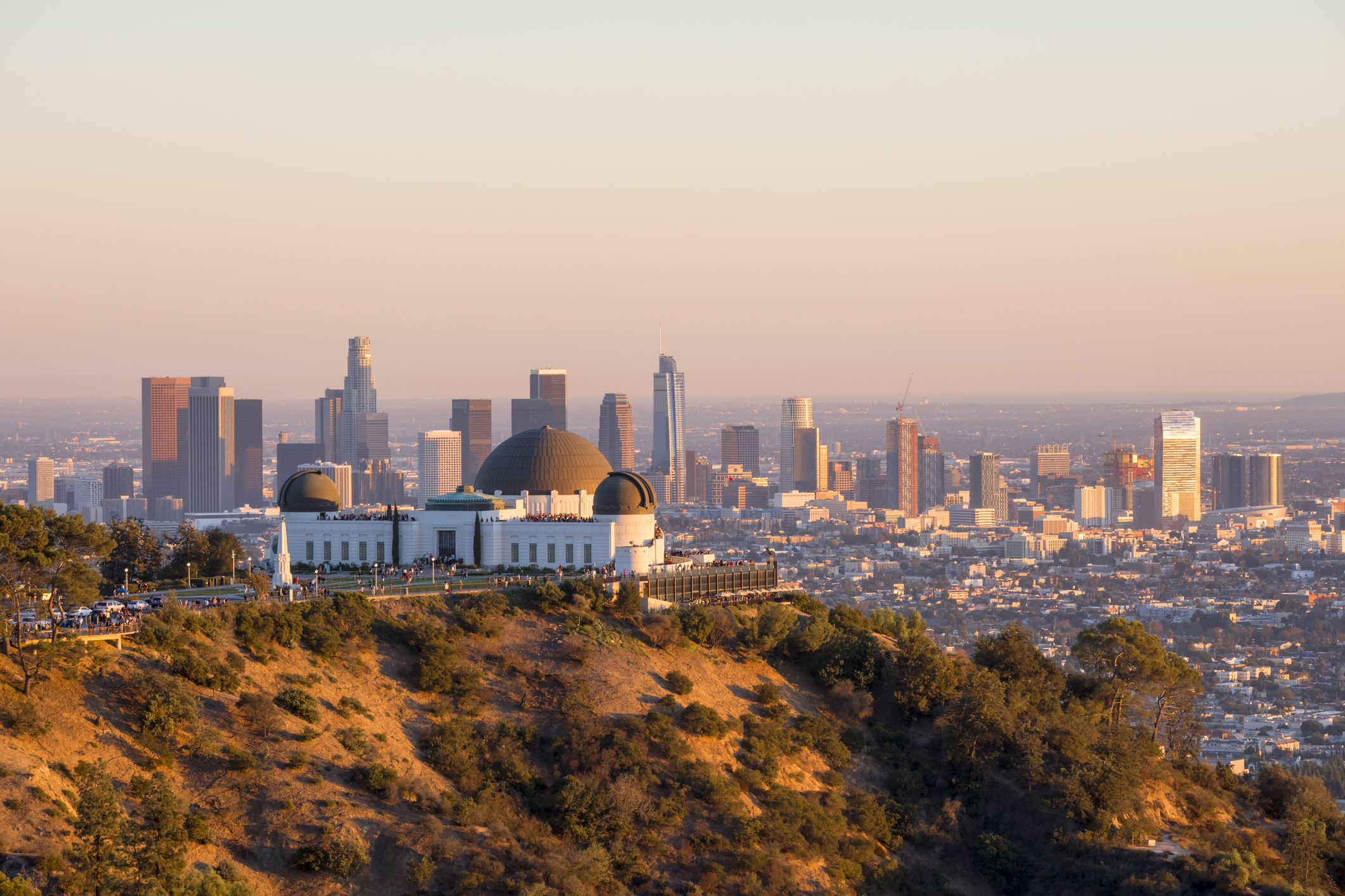 Los Angeles skyline at sunset with Griffith Observatory in the foreground