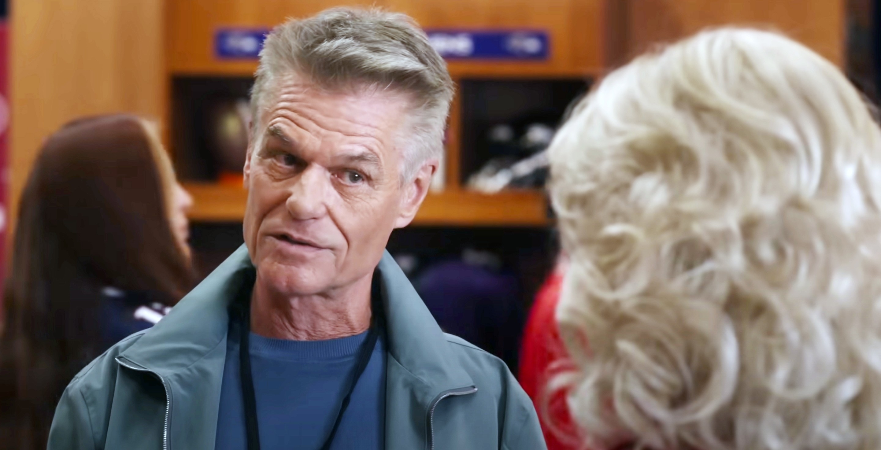 71-year-old Harry Hamlin in a jacket conversing with an older blonde woman in the film 80 For Brady