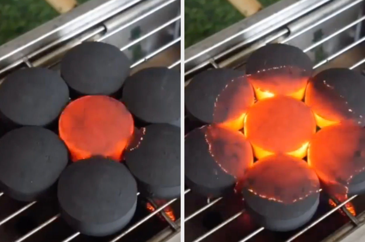 Charcoal briquettes on a grill, one glowing with heat in the center surrounded by unlit ones