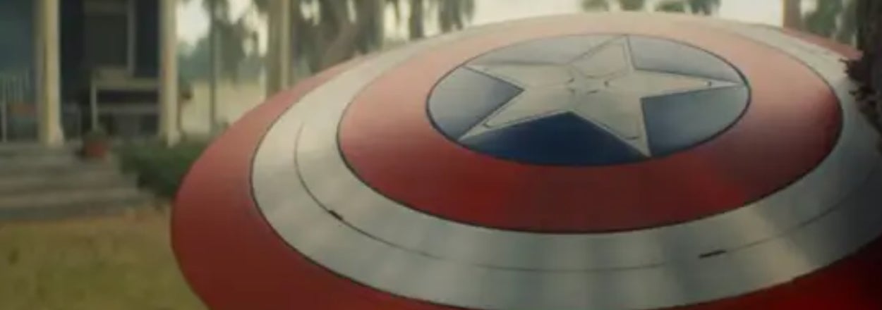 Captain America's shield leaning against a porch with the question "Who does this weapon belong to?" above it