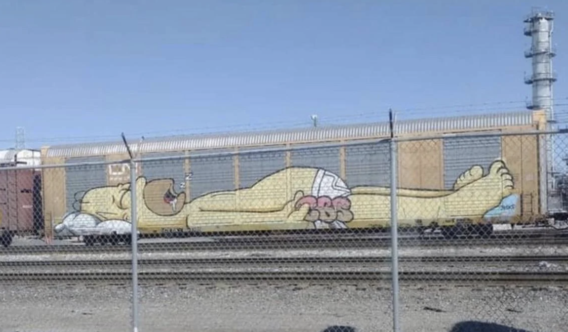 a mural of Homer Simpson on a train