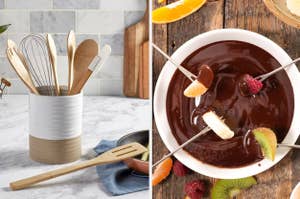 Assorted kitchen utensils in a holder; a bowl of chocolate fondue with fruit on skewers ready for dipping