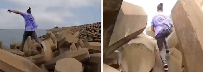 Person leaping between concrete blocks by the sea; a risky maneuver caught on video