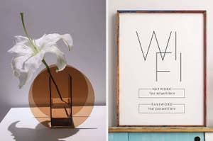 A vase with a geometric design holding a single lily; a framed Wi-Fi network and password sign for guests