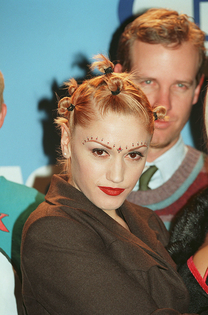 Gwen Stefani in a unique hairstyle and makeup with small gems, with a bindi on her forehead