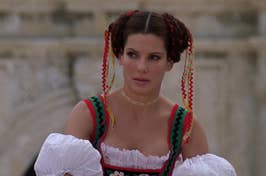 Woman in traditional folk dress with braided hair, from a film scene