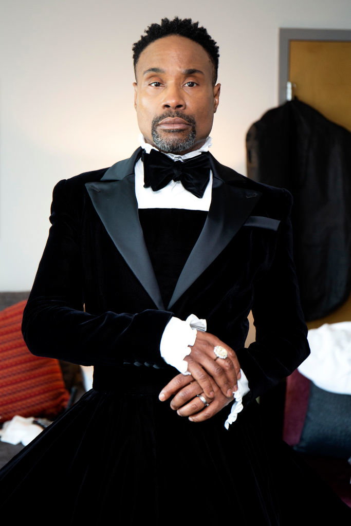 Billy Porter poses in a velvet tuxedo gown with a bow tie