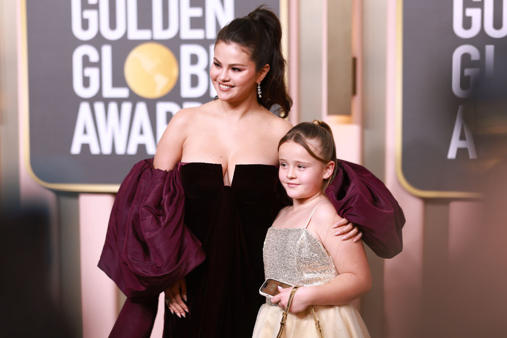 Selena Gomez and her sister, Gracie, pose together at the Golden Globes, both in elegant dresses