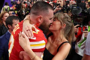 Travis Kelce and Taylor Swift kissing at the Super Bowl