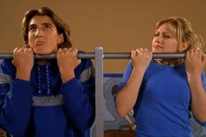 Two characters from a TV show doing pull-ups