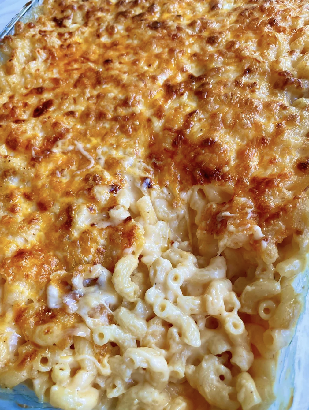Baked macaroni and cheese in a dish with a golden-brown crust