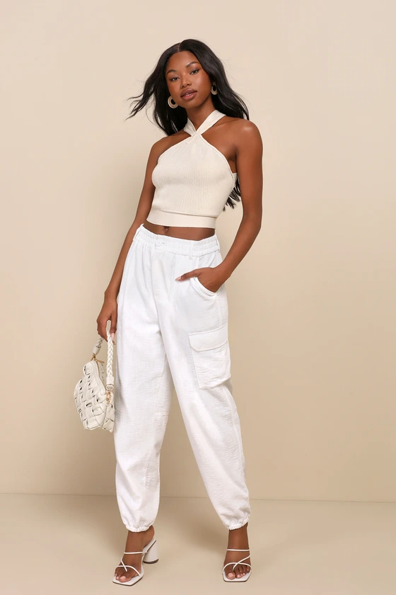 a model wearing the pants in white