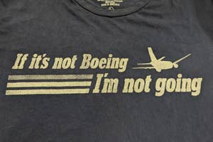 Black t-shirt with slogan "If it's not Boeing, I'm not going" and plane graphic