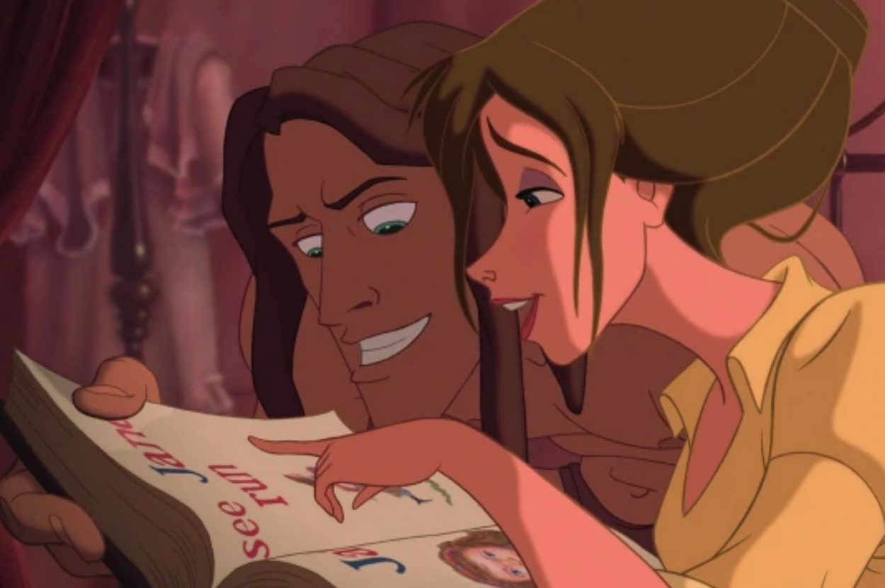 Belle and the Beast from Disney's "Beauty and the Beast" looking at a book together
