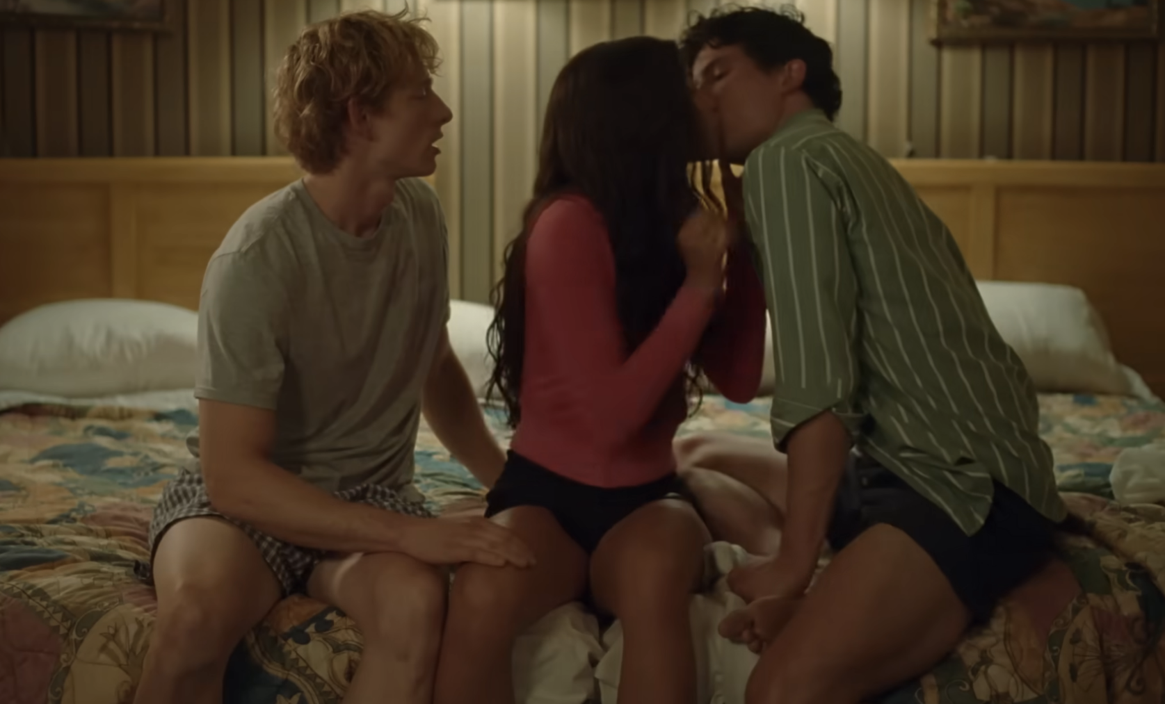 Three actors in a scene from &quot;Challengers,&quot; sitting closely on a bed